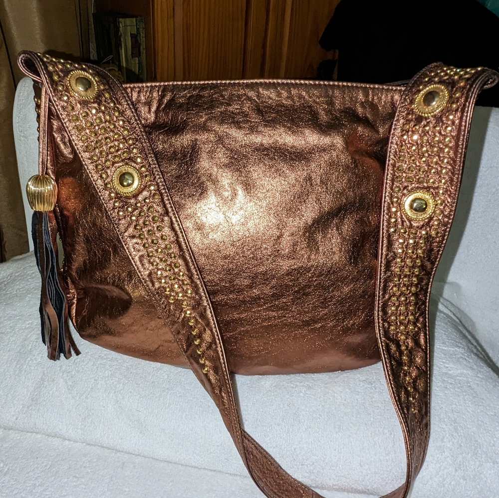 Pinky bronze metallic leather crossbody hobo bag.
